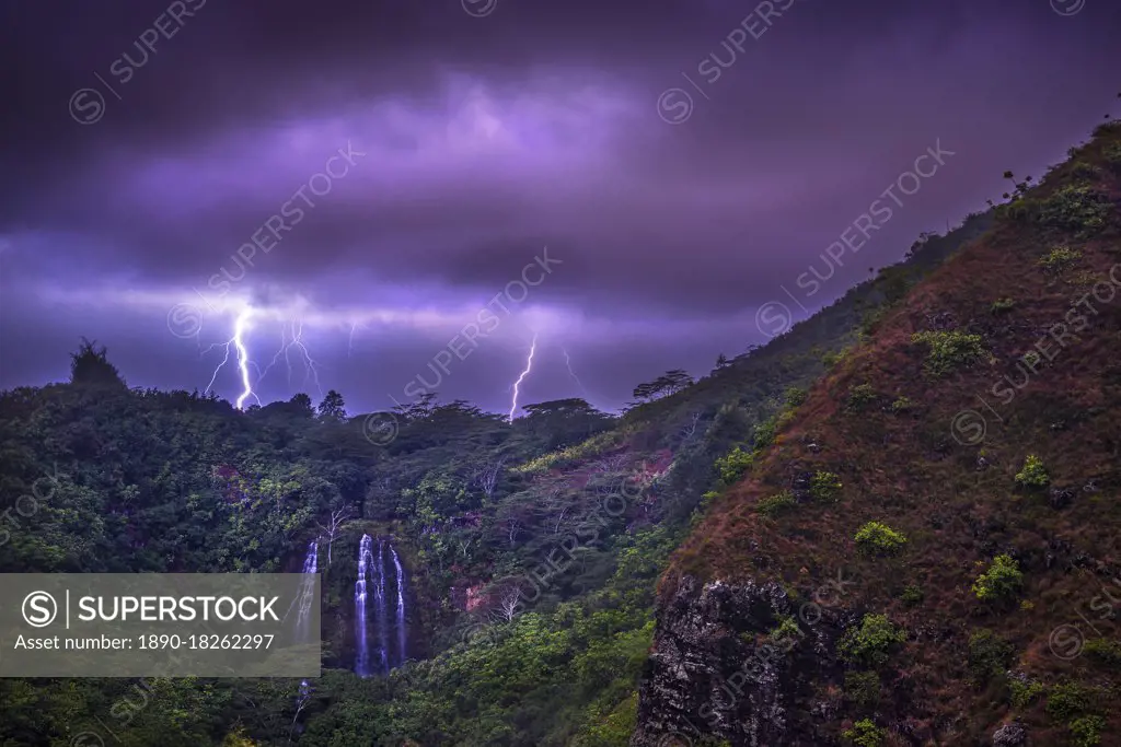 Lightning flashes behind Opekaa Falls, Kauai, Hawaii, United States of America, Pacific