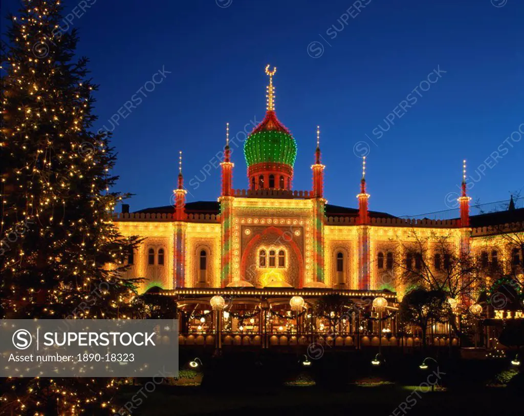 Illuminated Christmas tree and the Pavilion at dusk, Tivoli Gardens, Copenhagen, Denmark, Scandinavia, Europe