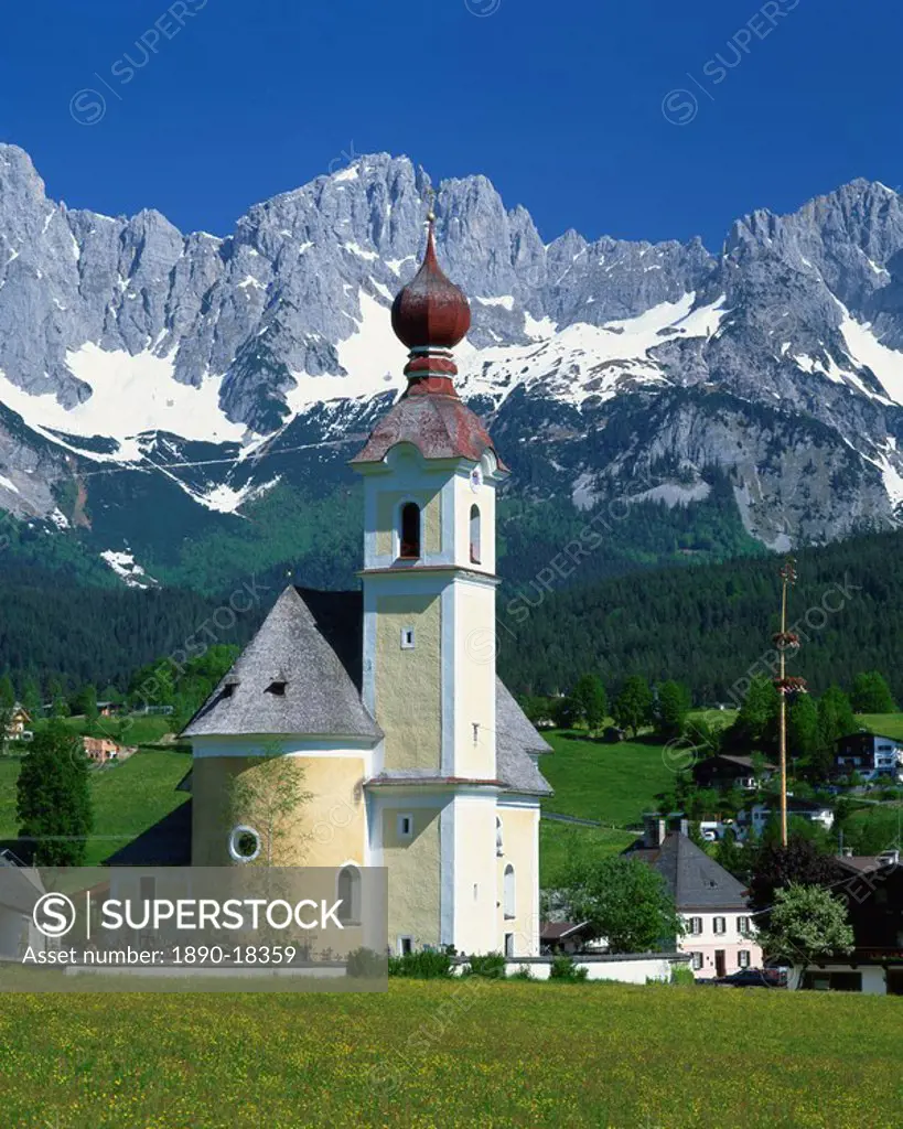Church with onion dome at Going, with mountains behind, in the Tirol, Austria, Europe