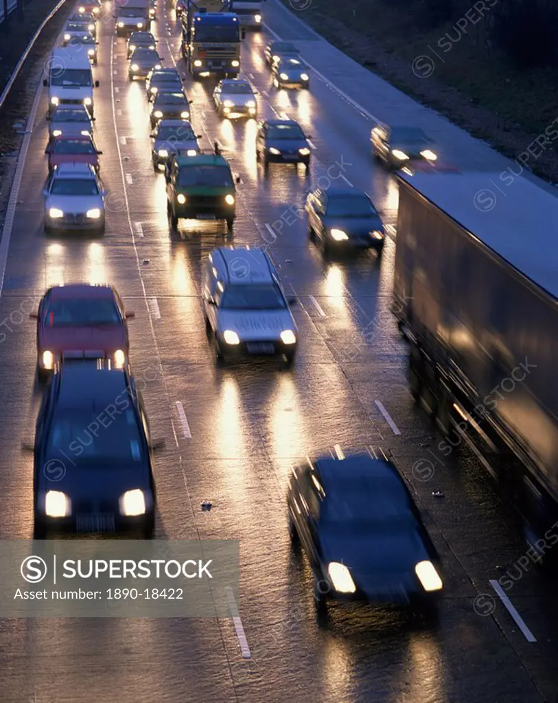 Traffic on wet motorway at dusk, United Kingdom, Europe