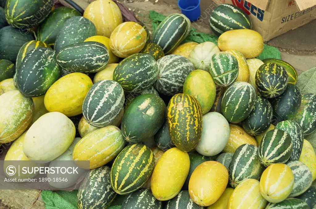 Yellow, green and speckled melons piled up for sale in Chiang Mai, Thailand, Southeast Asia, Asia