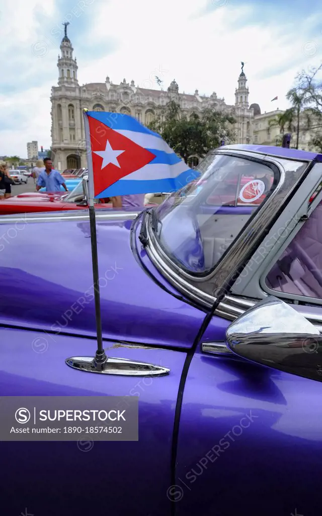 Cuban flag on antenna of vintage car, Havana, Cuba, West Indies, Central America