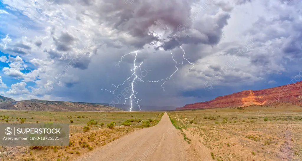 Lightning storm rolling across House Rock Valley Road on the west side of Vermilion Cliffs National Monument, Arizona, United States of America, North America