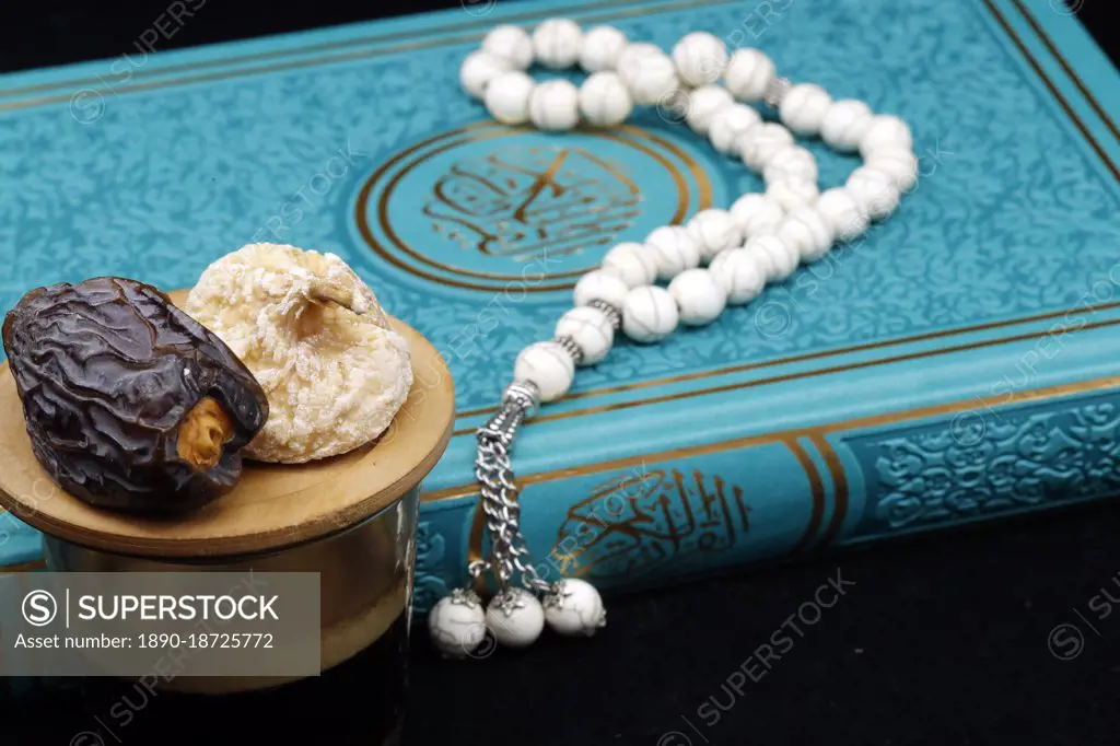 Holy Quran book with prayer beads and date, Ramadan concept, Muslim faith and religion, France, Europe