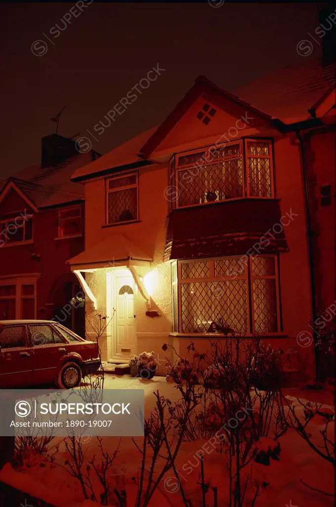 A house in the Crossways at night with snow on the ground, in Heston, Middlesex, England, United Kingdom, Europe