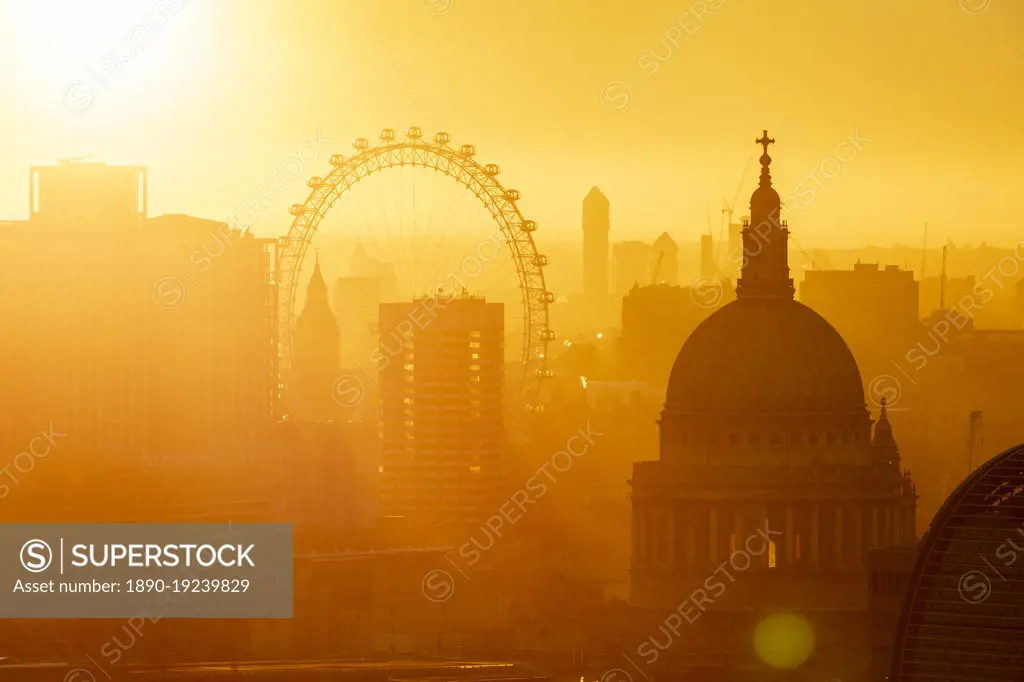 Aerial view of London skyline at sunset, including London Eye and St. Paul's Cathedral, London, England, United Kingdom, Europe