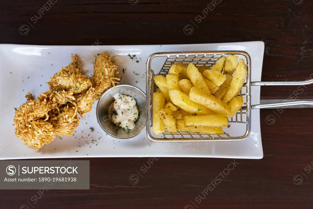 Overhead view of crunchy fried coconut prawns with french fries in a tray, Antigua, Leeward Islands, West Indies, Caribbean, Central America