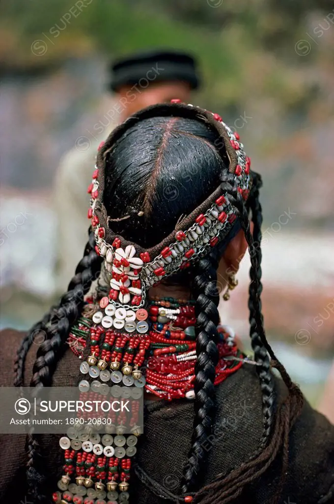 The back view of a womans head_dress and greased hair at Rumboor in Kafiristan, Pakistan, Asia