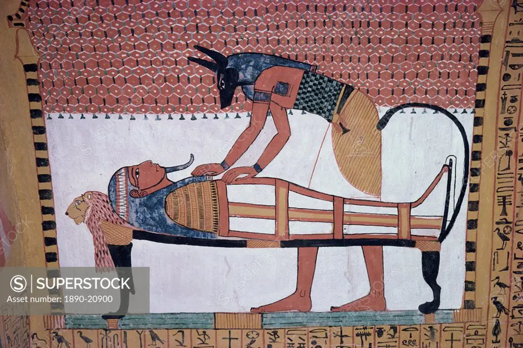 Mural showing the god Anubis leaning over mummy of Ramses II, in the Tomb of Sinjin, chief artist to Ramses II, Deir el Medina, Thebes, UNESCO World H...