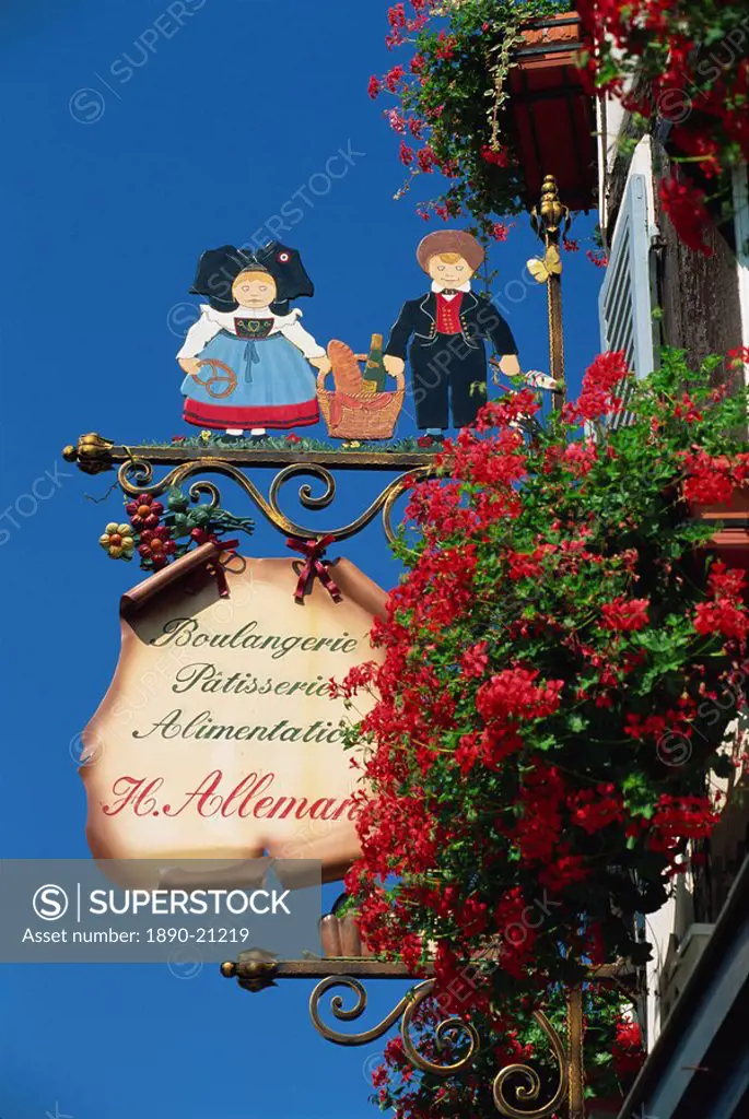 Sign outside traditional patisserie, red flowers prominent, Eguisheim, Haut_Rhin, Alsace, France, Europe