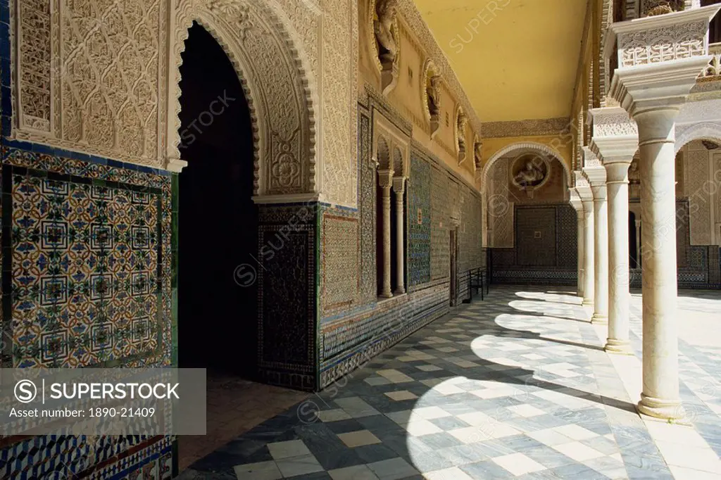 Arcade of the Patio Principal showing Mudejar carving and tilework, Casa de Pilatos, Seville, Andalucia Andalusia, Spain, Europe