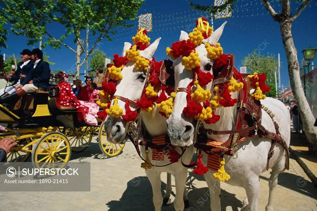 Pair of horses decorated with colourful headgear, Feria de Abril April Fair, Seville, Andalucia Andalusia, Spain, Europe