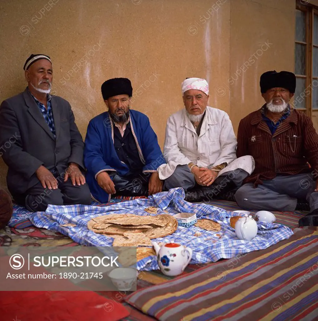 Uzbek imam and Muslims in a mosque, Khiva, Uzbekistan, Central Asia, Asia