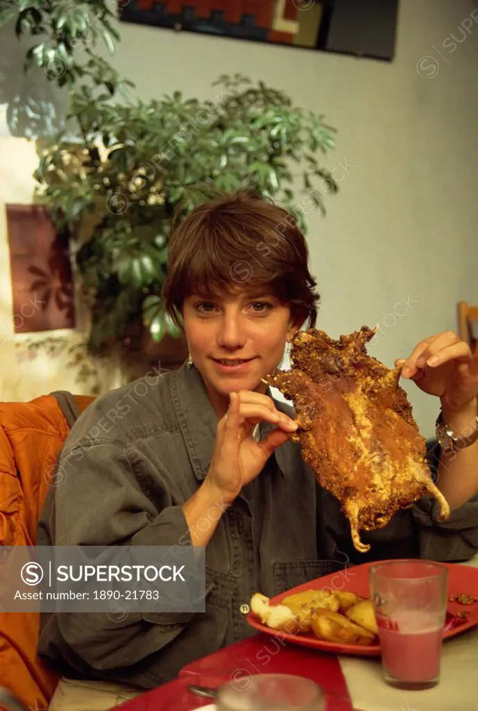 Enjoying a guinea pig lunch, Cuzco, Peru, South America