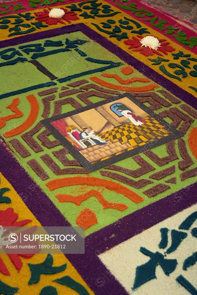 Close_up of coloured sawdust rug on the street on Good Friday during Semana Santa in Antigua, Guatemala, Central America