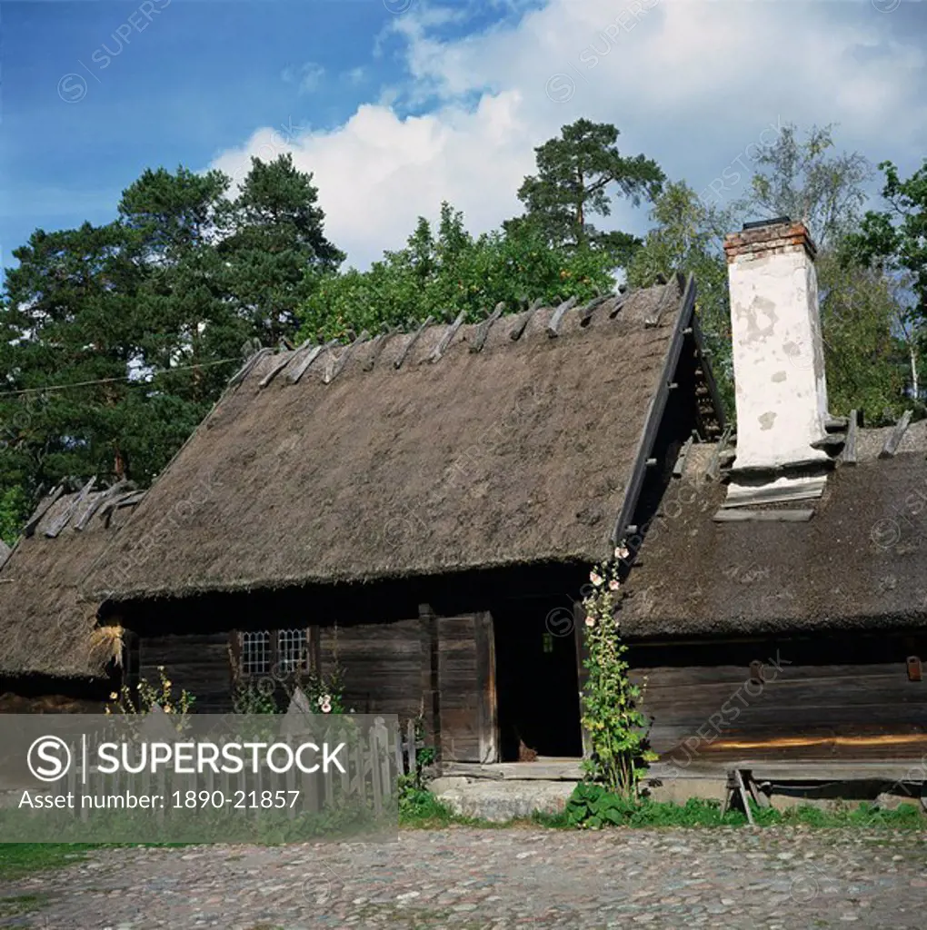 Wooden building with thatched roof of the Oktorp farmstead from Halland, dating from the 18th century, in the Skansen Open Air Museum, in Stockholm, S...