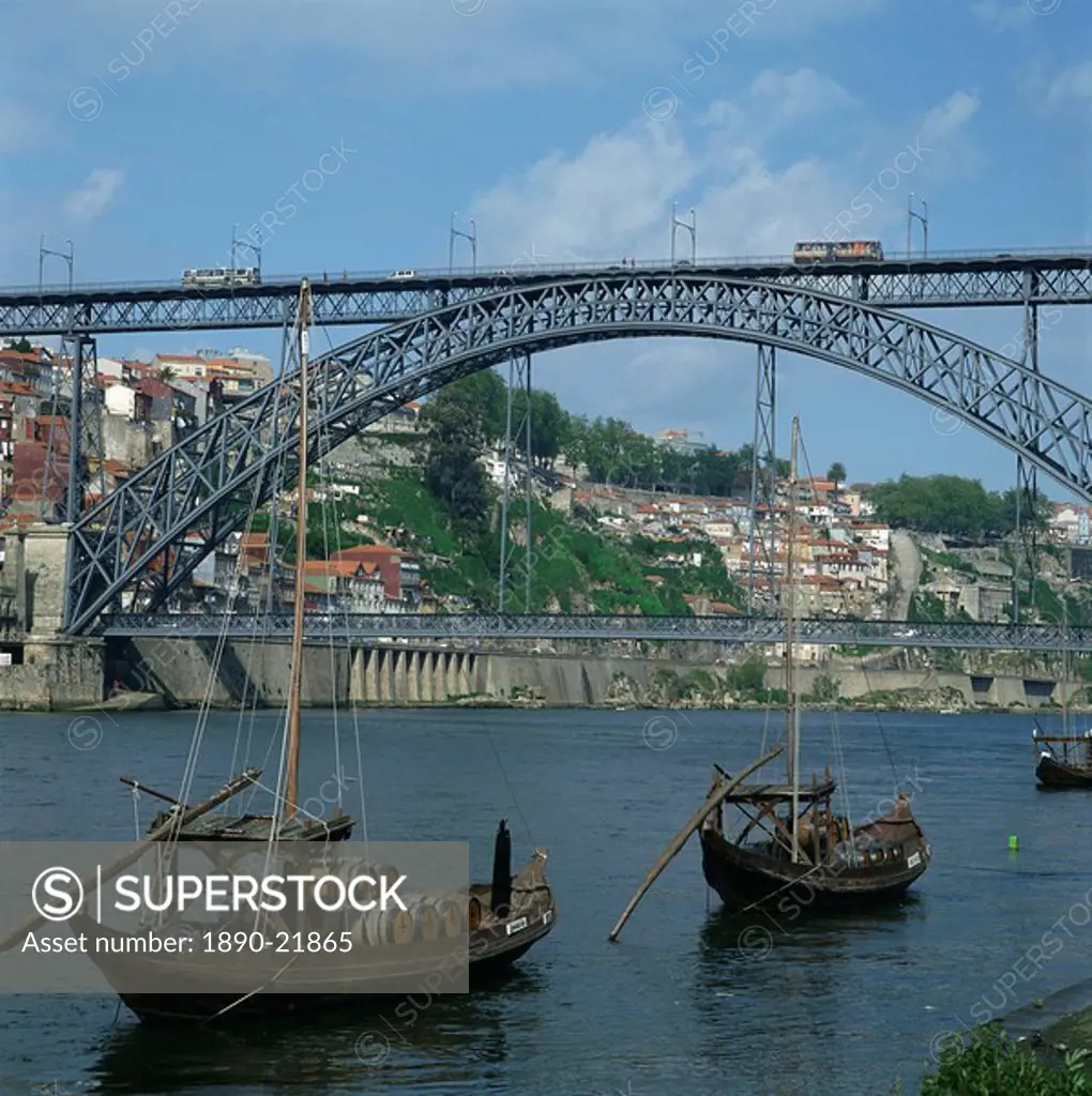 Barco rabelo, the port barges on the River Douro, with the Dom Luis I bridge behind in the city of Oporto, Portugal, Europe