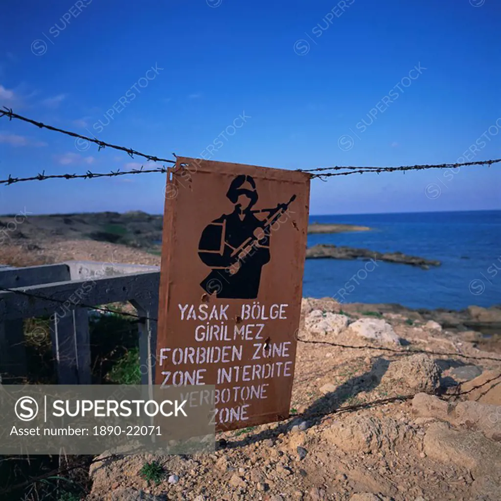 Barbed wire and forbidden zone sign of Turkish Military zone, common following 20 July 1974 invasion, near Lapta, Lambousa, North Cyprus, Europe