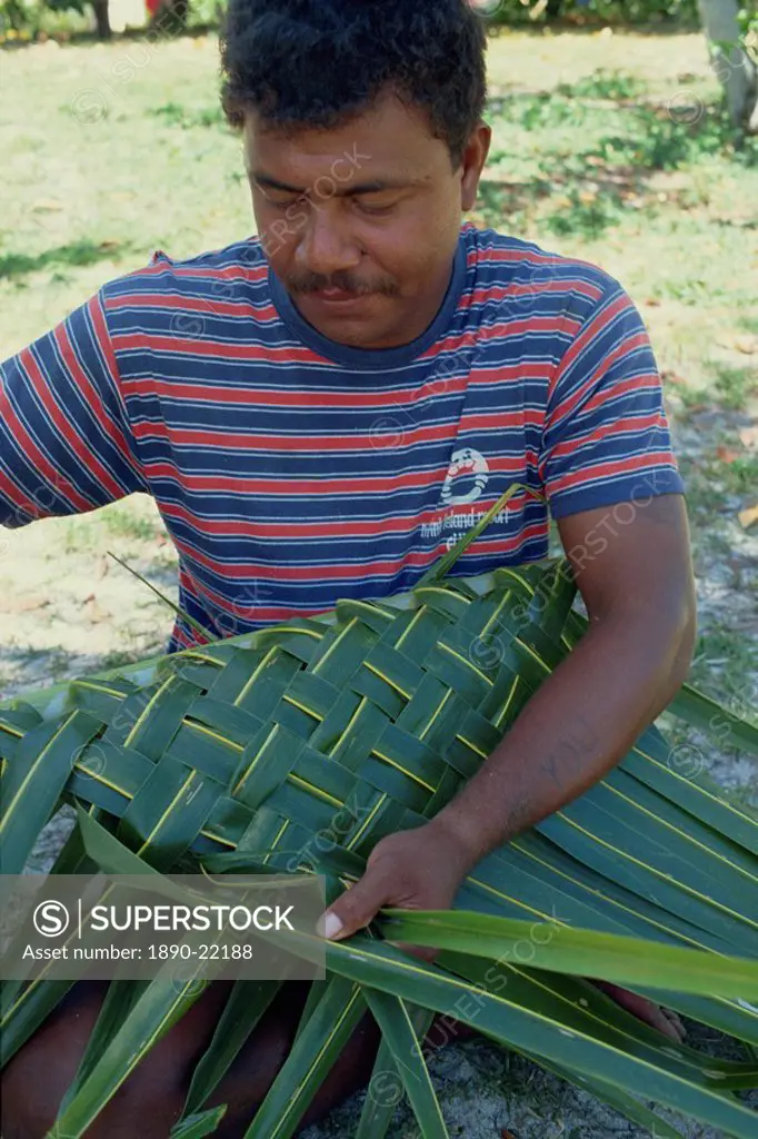 Portrait of a man basket weaving on Navini Island, Fiji, Pacific Islands, Pacific