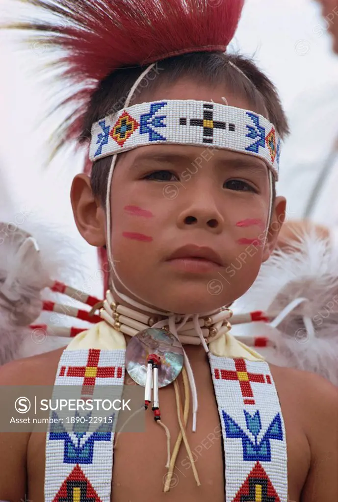 Portrait of young Crow indian boy in traditional costume, New Mexico, United States of America, North America