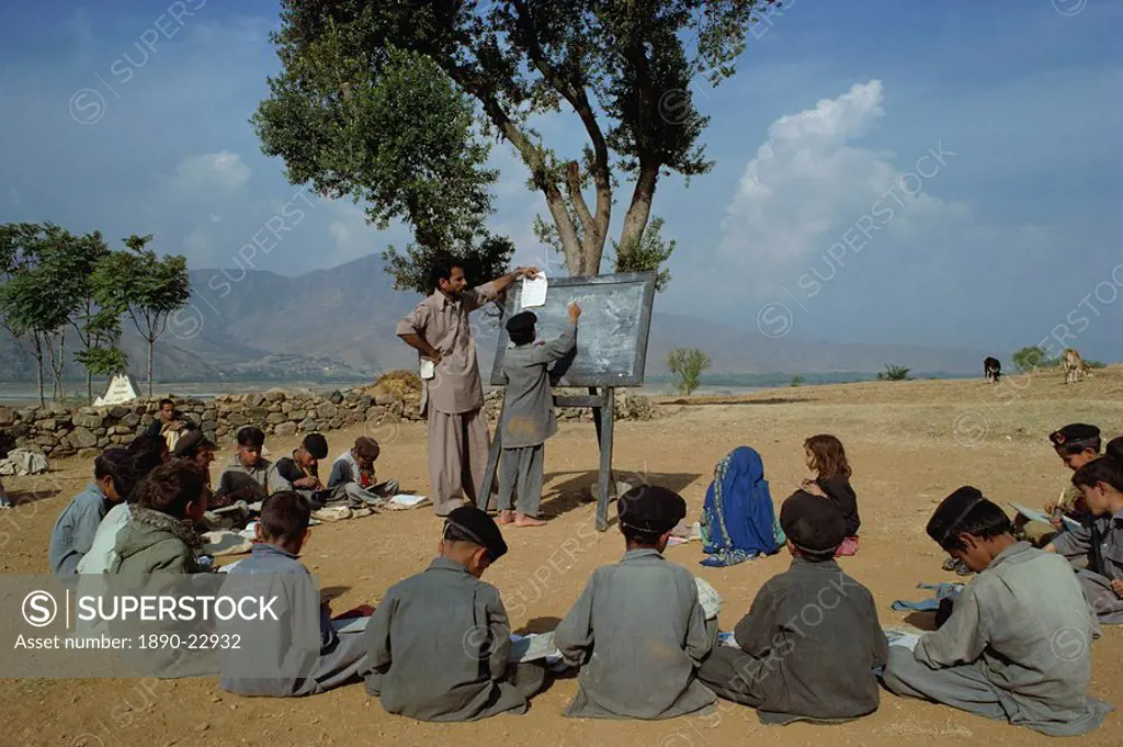 Two school girls separated from the boys at a village school in the Swat valley, Pakistan, Asia