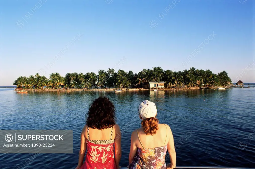 Girls looking at view, Tobacco Cay, Belize, Central America