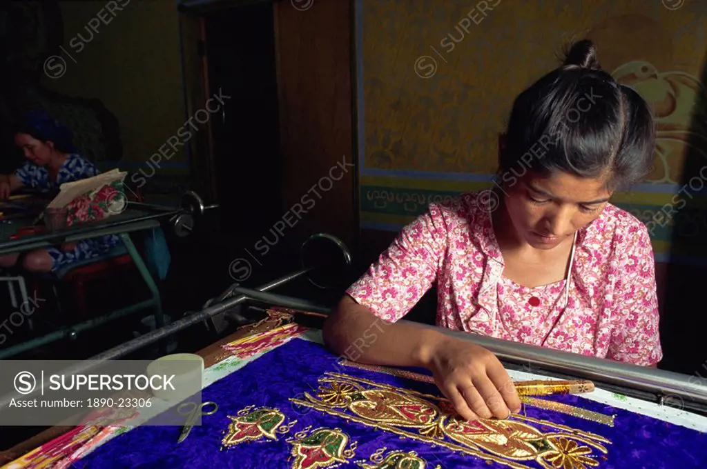 Worker in embroidery factory, Bukhara, Uzbekistan, Central Asia, Asia