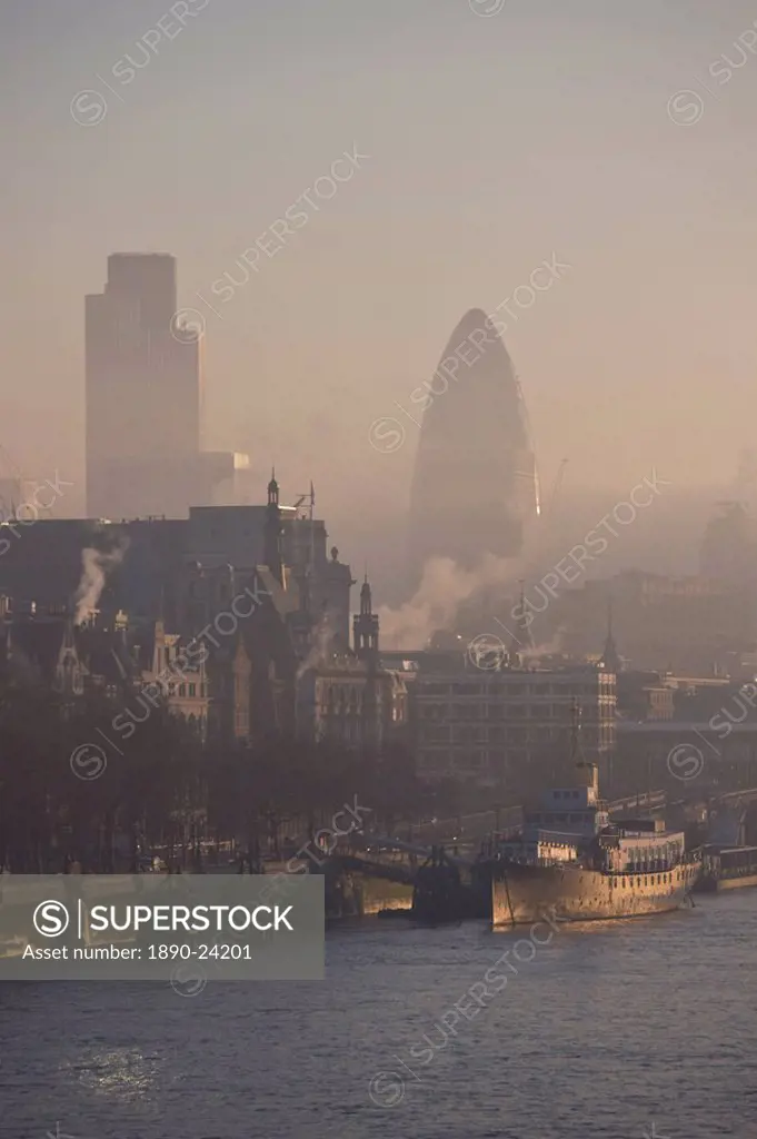 Early morning fog hangs over the City of London skyline, London, England, United Kingdom, Europe