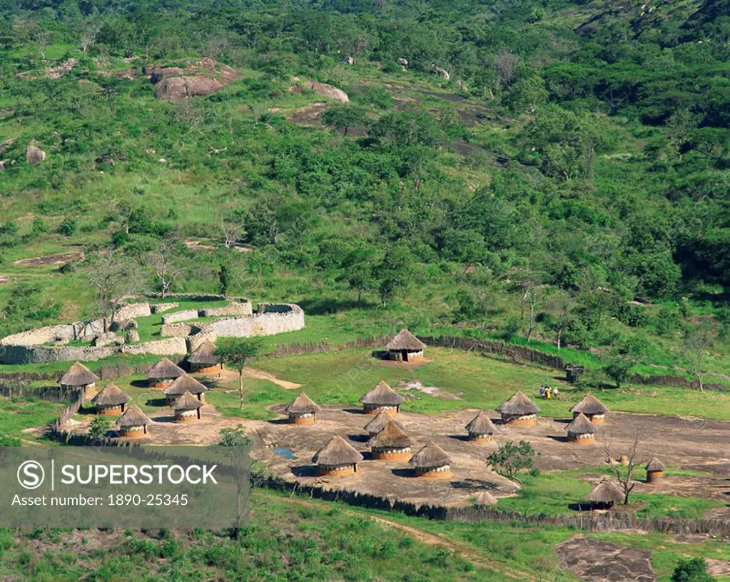 Nearby huts and Great Zimbabwe National Monument, UNESCO World Heritage Site, Zimbabwe, Africa