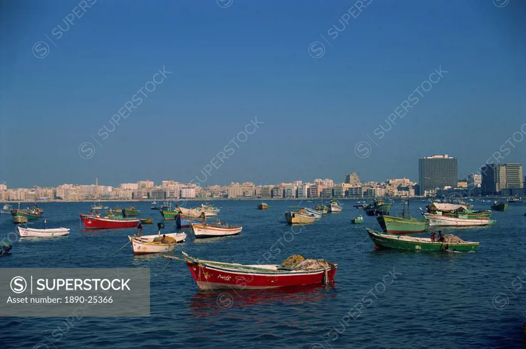 Moored boats before city skyline, Alexandria, Egypt, North Africa, Africa