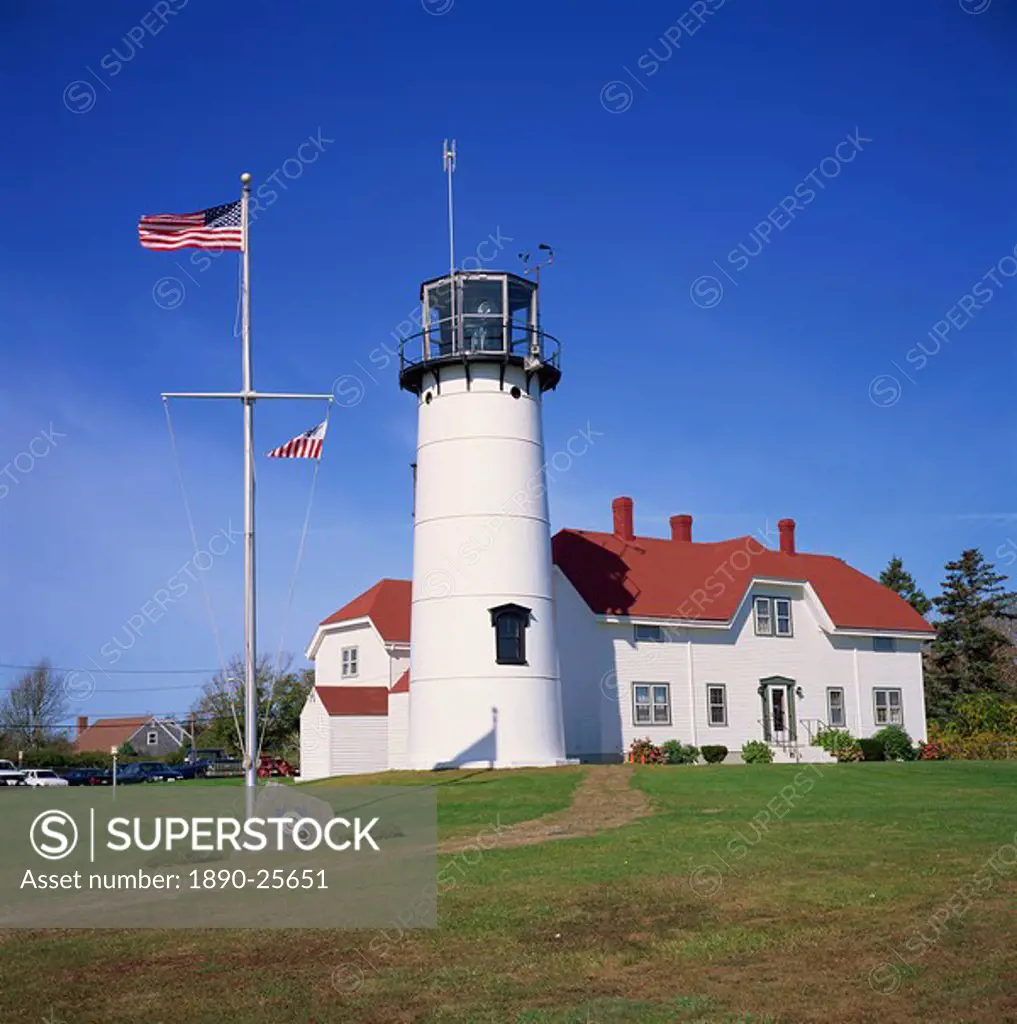 The American flag flying beside the Chatham lighthouse at Cape Cod, Massachusetts, New England, United States of America, North America
