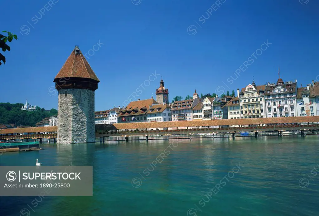 The Chapel Bridge and Water Tower with the city of Lucerne beyond, Switzerland, Europe