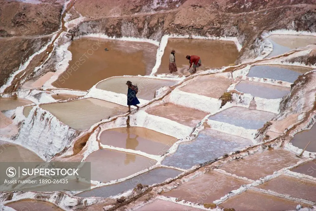 Workers in the salt pans on terraces at Salinas, Cuzco, Peru, South America