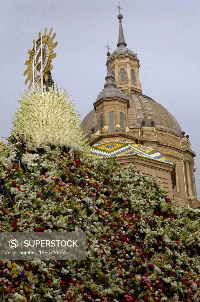 The icon of Nuestra Senora del Pilar covered in flowers outside the Basilica during the annual fiesta, Zaragoza, Aragon, Spain, Europe