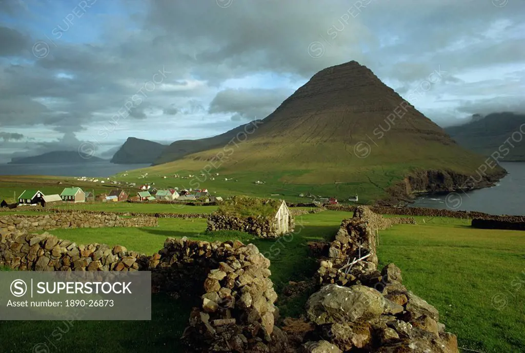 Landscape containing dry stone walls and a small settlement, Faroe Islands, Denmark, Europe