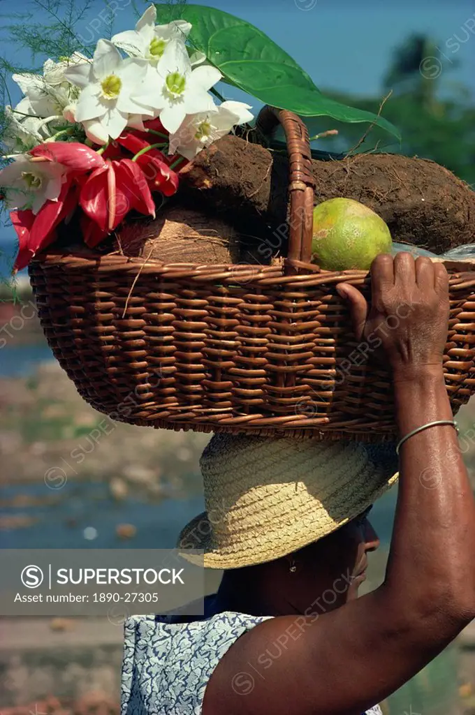 Woman carrying basket on her hand on market day, Roseau, Dominica, Windward Islands, West Indies, Caribbean, Central America