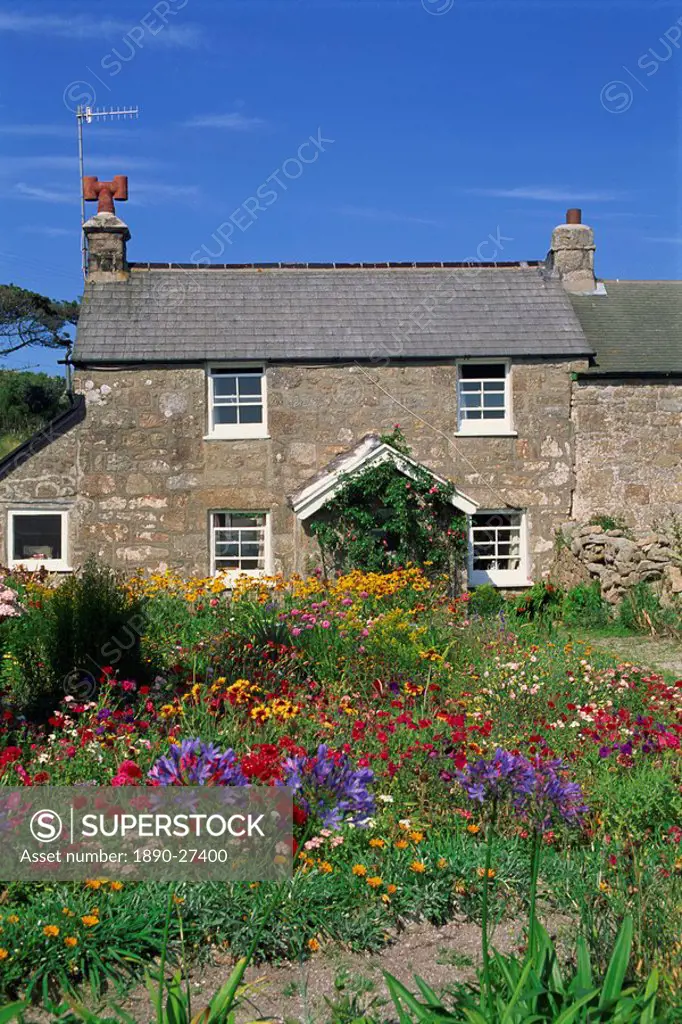 Stone cottage and colourful garden at New Grimsby on Tresco in the Scilly Isles, England, United Kingdom, Europe