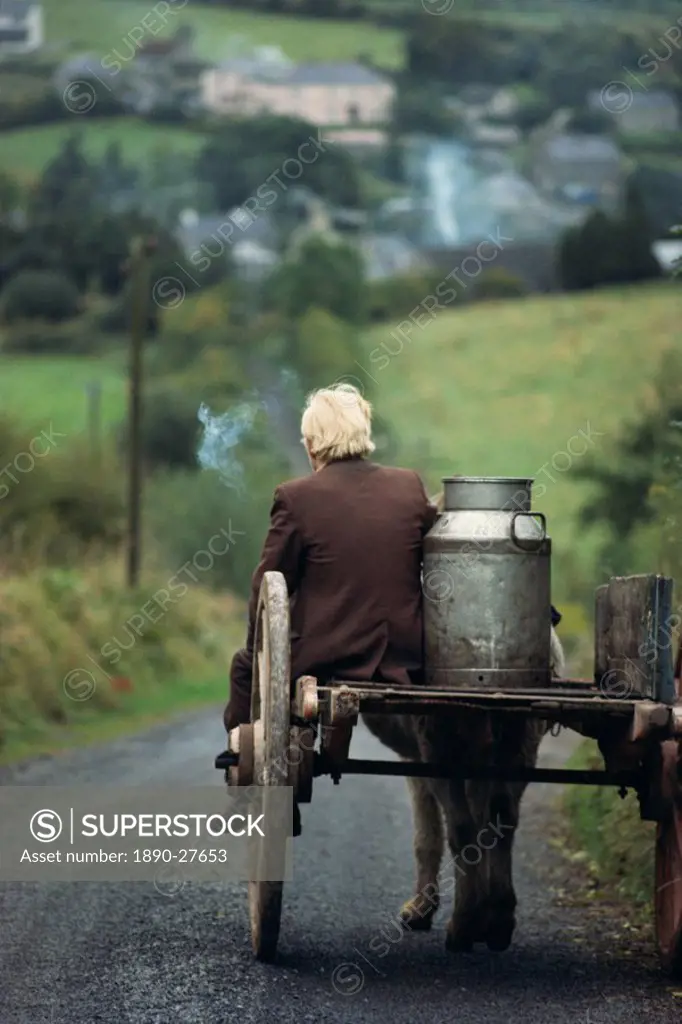Figure riding cart with milk churn, Arigna, Shannon River, County Leitrim, Connacht, Republic of Ireland, Europe
