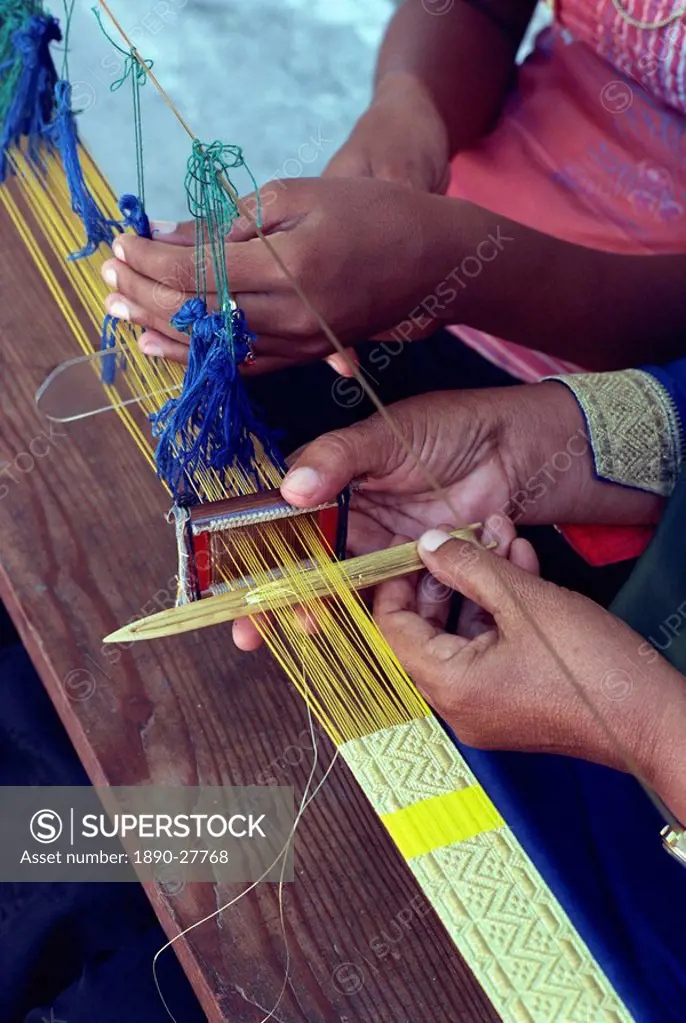 Weavers hands using a narrow loom in the Maldive Islands, Asia
