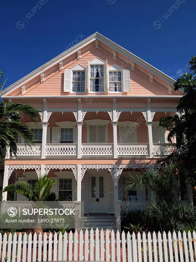A gingerbread house with white fretwork and verandah, Key West, Florida, United States of America, North America