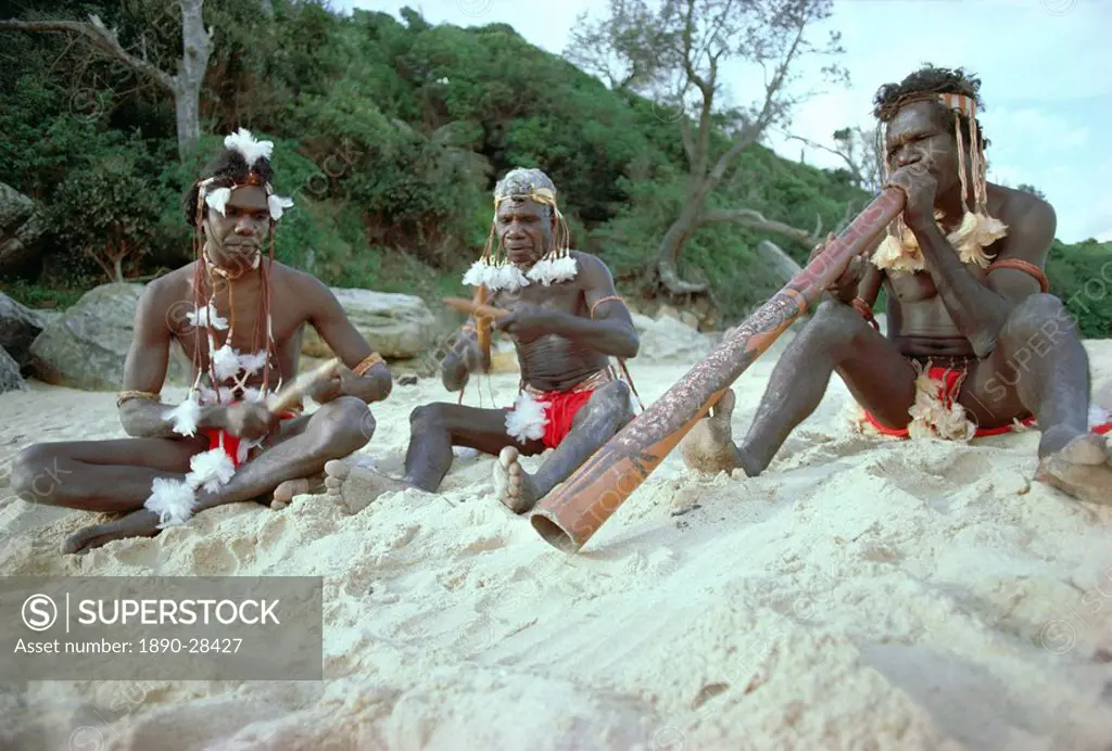 Three Aborigines playing musical instruments, Northern Territory, Australia, Pacific