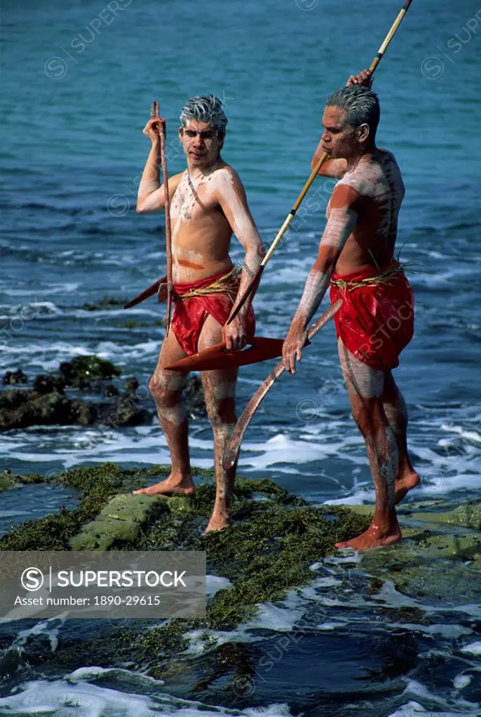 Two Aborigines with body decoration hunting seafood at Jervis Bay, New South Wales, Australia, Pacific