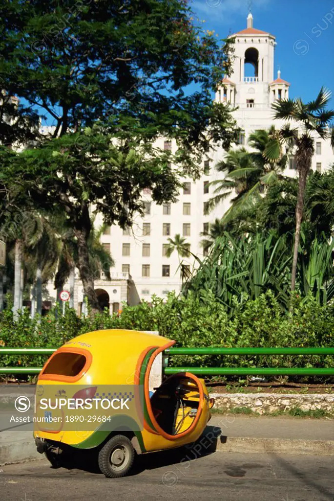 Yellow tuk tuk taxi and Hotel Nacional, Havana, Cuba, West Indies, Central America