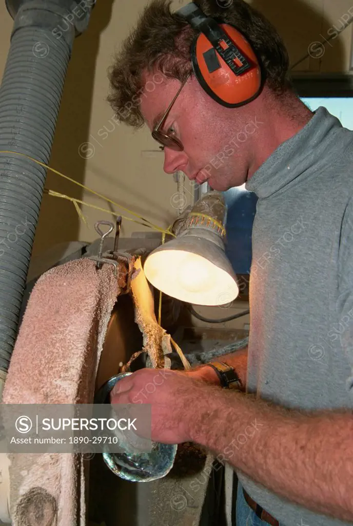 Craftsman making jewellery from abalone shells, Pahia Point, New Zealand, Pacific