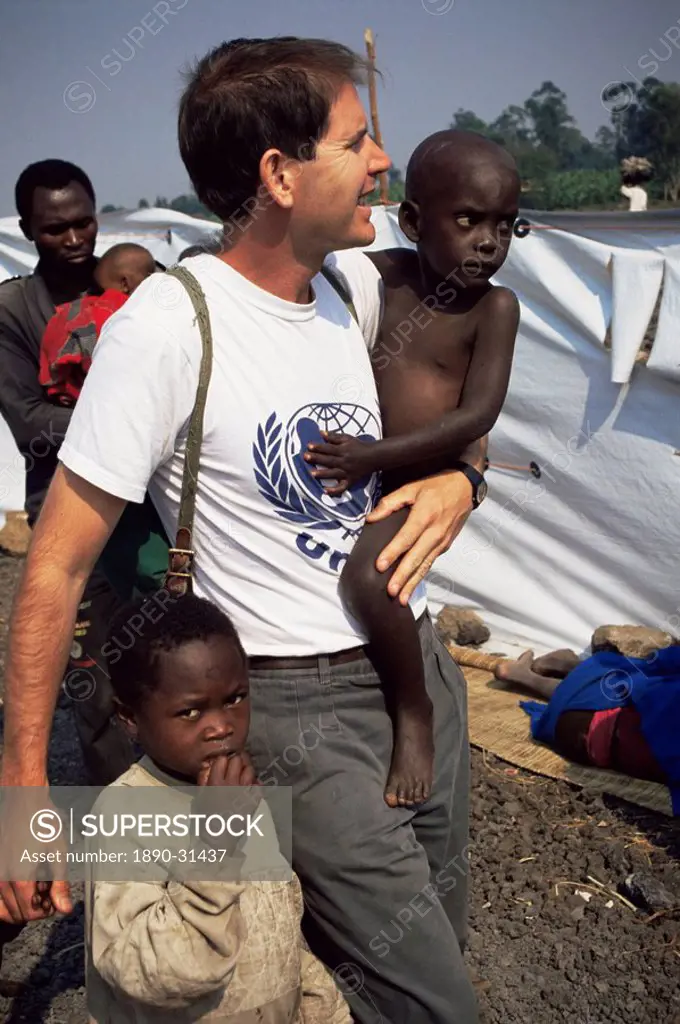UNICEF representative with orphans, Goma, Zaire, Africa