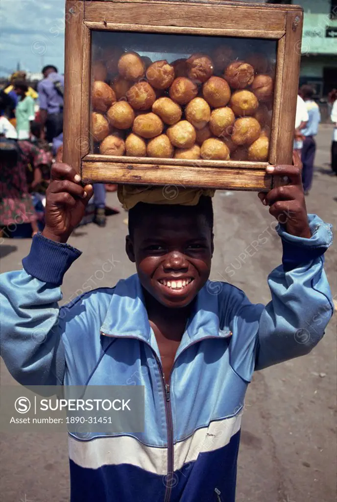 Boy selling bean cakes, Monrovia, Liberia, West Africa, Africa