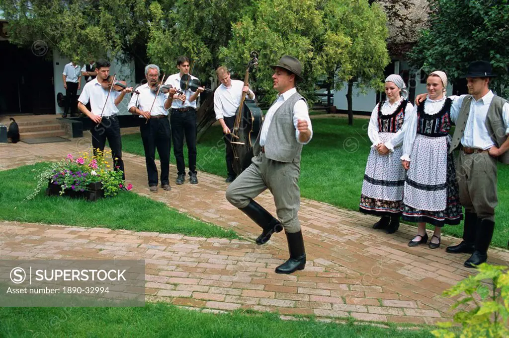 Folk dancing on horse farm in the Puszta, Hungary, Europe