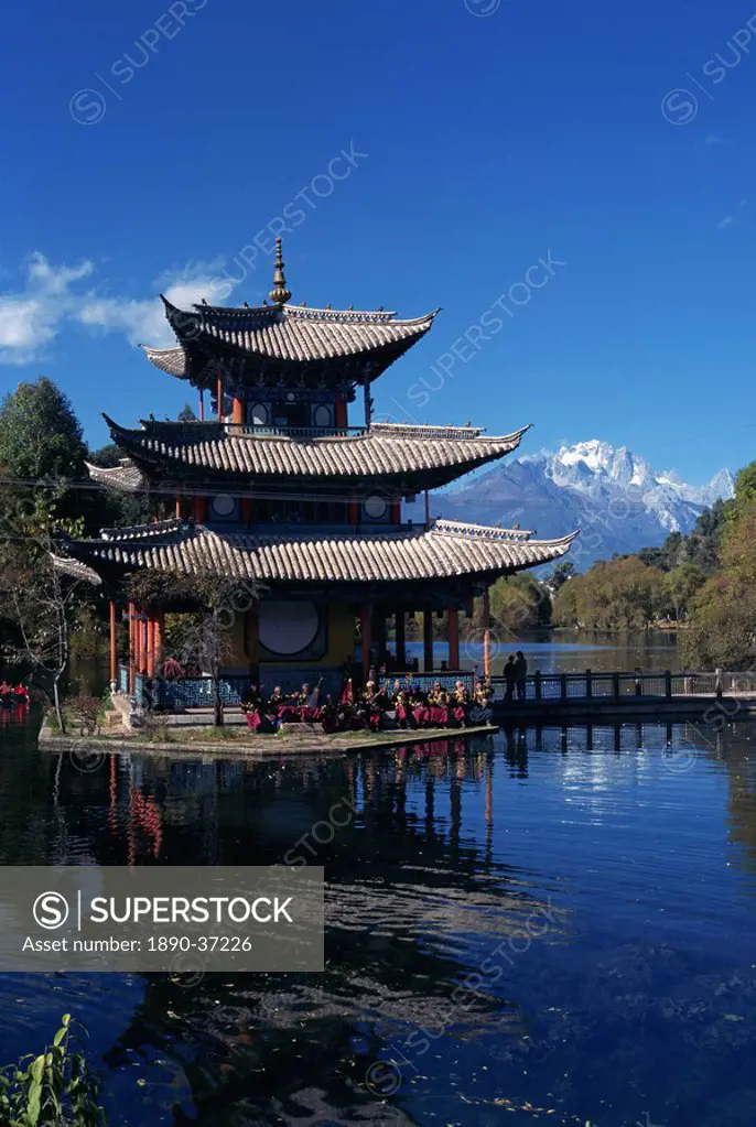 The Naxi orchestra practises beneath a pagoda by the Black Dragon Pool in Lijiang, Yunnan Province, China, Asia