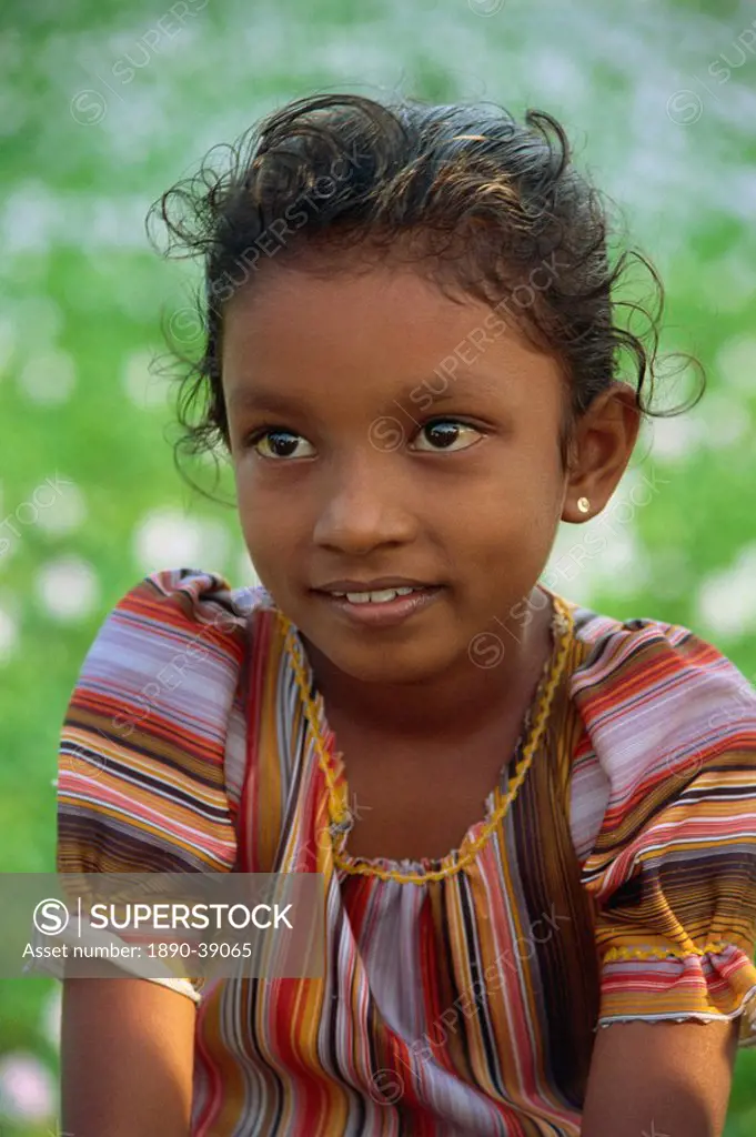 Head and shoulders portrait of a young Sri Lankan girl near Kandy, Sri Lanka, Asia