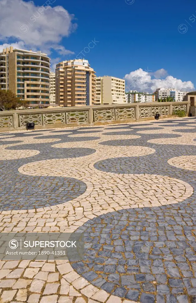 Black and white cobble design on the promenade above Praia da Rocha beach, Portimao, Algarve, Portugal, Europe